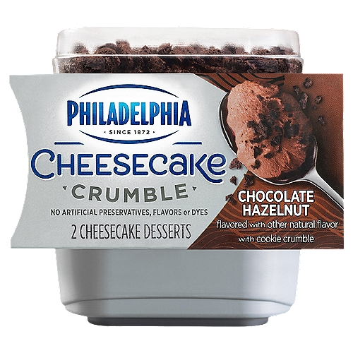 PHILADELPHIA Cheesecake Crumble Chocolate Hazelnut Cheesecake Dessert is a personal serving of creamy PHILADELPHIA Cheesecake base with real cookies crumbles and chocolate flavored sauce. Each dessert is made with no artificial preservatives, flavors, or dyes. Just open the convenient Philadelphia Cheesecake Crumble cups, pour the cookie crumbles on top, mix and dig into a delicious indulgent dessert. It's the perfect easy dessert for one that can be enjoyed anytime, anywhere. Each package comes with two Chocolate Hazelnut cheesecake dessert cups that are just too good to be shared.nn• 2 PHILADELPHIA Cheesecake Crumble Chocolate Hazelnut Cheesecake Dessertsn• A delicious 3-layer PHILADELPHIA cheesecake with a chocolate flavored sauce on the bottom, rich and creamy cheesecake filling and cookie crumbles on top for a perfectly indulgent after dinner treatn• A delicious 3-layer PHILADELPHIA cheesecake with toppings on the bottom, a rich and creamy cheesecake filling and cookie crumbles on top for a perfectly indulgent after dinner treatn• Made with no artificial preservatives, flavors, or dyesn• Just open the convenient PHILADELPHIA Cheesecake Crumble dessert, pour the cookie crumbles on top, mix and dig inn• Served in a personal dessert cup that's just too good to be sharedn• The perfect chocolate dessert for one