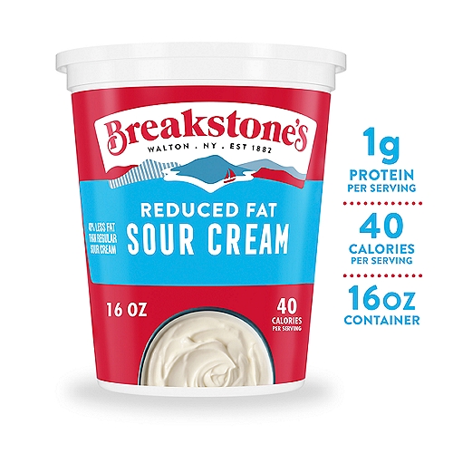 Breakstone's Reduced Fat Sour Cream, 16 oz Tub
Breakstone's Reduced Fat Sour Cream delivers the classic taste and creamy texture you know and love with less fat. Made from cultured pasteurized Grade A milk and cream, this delicious sour cream is always a great addition to meals and side dishes. With 40% less fat than regular sour cream, reduced fat sour cream is the perfect recipe ingredient for those looking to reduce fat from their diet. Enjoy reduced fat sour cream on baked potatoes or as a creamy sandwich topping. Add a dollop to tomato soup or taco pizza, or make a delicious French onion dip for veggies or chips. The convenient resealable 16 ounce tub stores neatly in your refrigerator and keeps this sour cream ready for when a craving hits. Breakstones sour cream is always creamy and deliciously satisfying because Breakstone's has been made with quality, care, and the finest ingredients since 1882.

• One 16 oz. tub of Breakstone's Reduced Fat Sour Cream
• Breakstone's Reduced Fat Sour Cream delivers classic sour cream taste and texture with less fat
• Made with cultured pasteurized Grade A milk and cream
• Contains 40% less fat than regular sour cream
• Certified Grade A pasteurized sour cream
• Dollop some creamy sour cream on top of layered nachos or chili, or use it as a chip dip
• Packaged in a resealable tub for lasting freshness in the fridge
• Certified Kosher sour cream