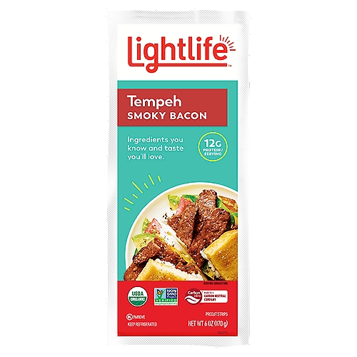 Lightlife Smoky Bacon Precut Strips Tempeh, 6 oz
Lightlife® Organic Smoky Bacon Tempeh Strips are a versatile plant-based protein source for vegans and flexitarians alike. Made with Non-GMO and vegan ingredients, our savory Smoky Tempeh strips have a deep, smoky flavor that naturally enhances a variety of recipes and works well as a healthier alternative to bacon. Whether you fry, sauté, or bake it, the protein-rich tempeh strips add balanced flavor to grain bowls, rice dishes, salads, sandwiches, and more. For over 40 years, the Lightlife® brand has been committed to creating delicious and nutritious plant-based meat alternatives and looking for ways to improve the impact we have on the planet.

plant based meal, vegetarian meal, plant based protein, plant based meat, tempeh strips, smoky tempeh strips, soy tempeh, tofu, tofu alternative